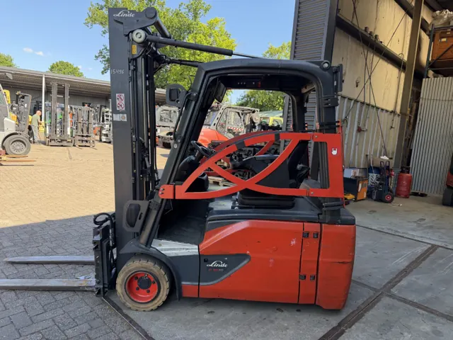 Linde three-wheel electric forklift outdoors, side view