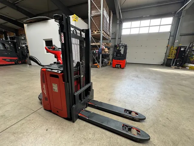 Red Linde electric stacker in a warehouse