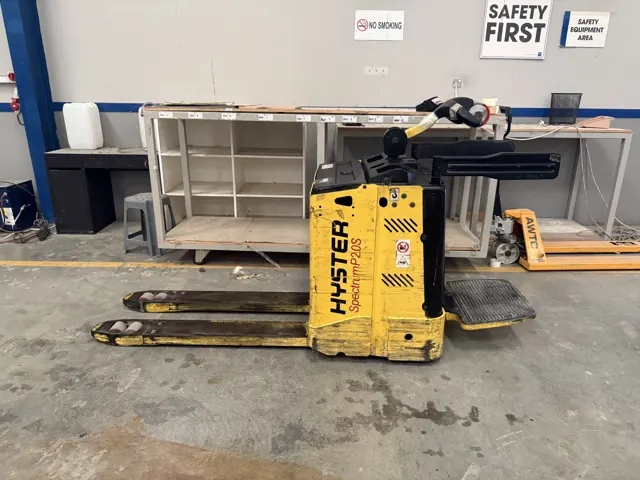 Yellow Hyster electric pallet truck on a warehouse floor