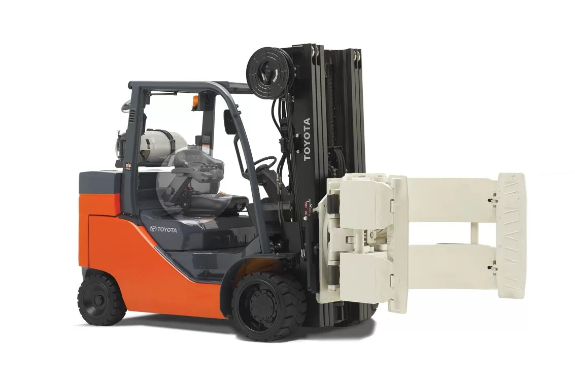 Forklift drum clamp handling a barrel