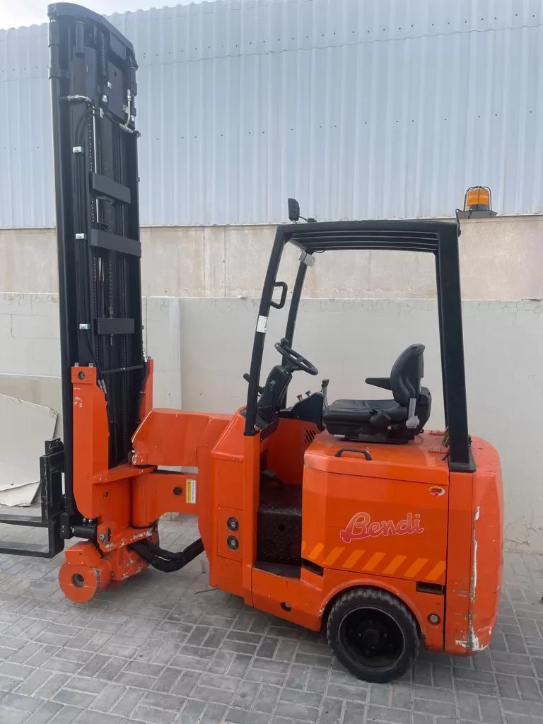 Red industrial forklift with lifting mast