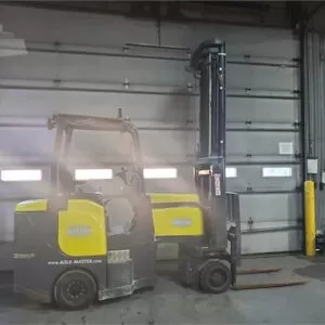 Electric forklifts inside industrial warehouse