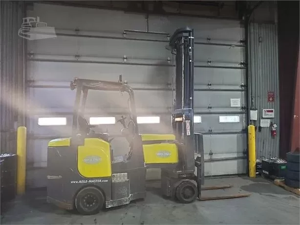 Electric forklifts inside industrial warehouse