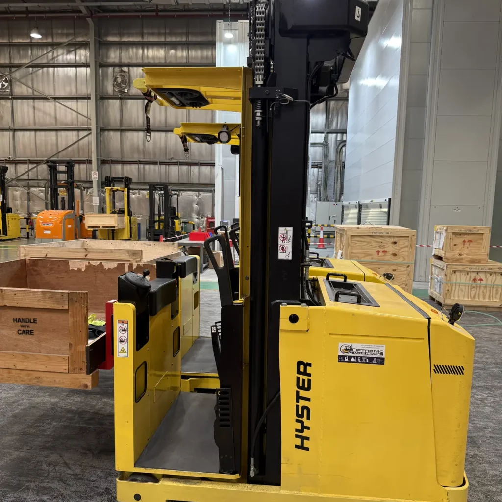 Hyster order picker with the operator platform lowered in a warehouse